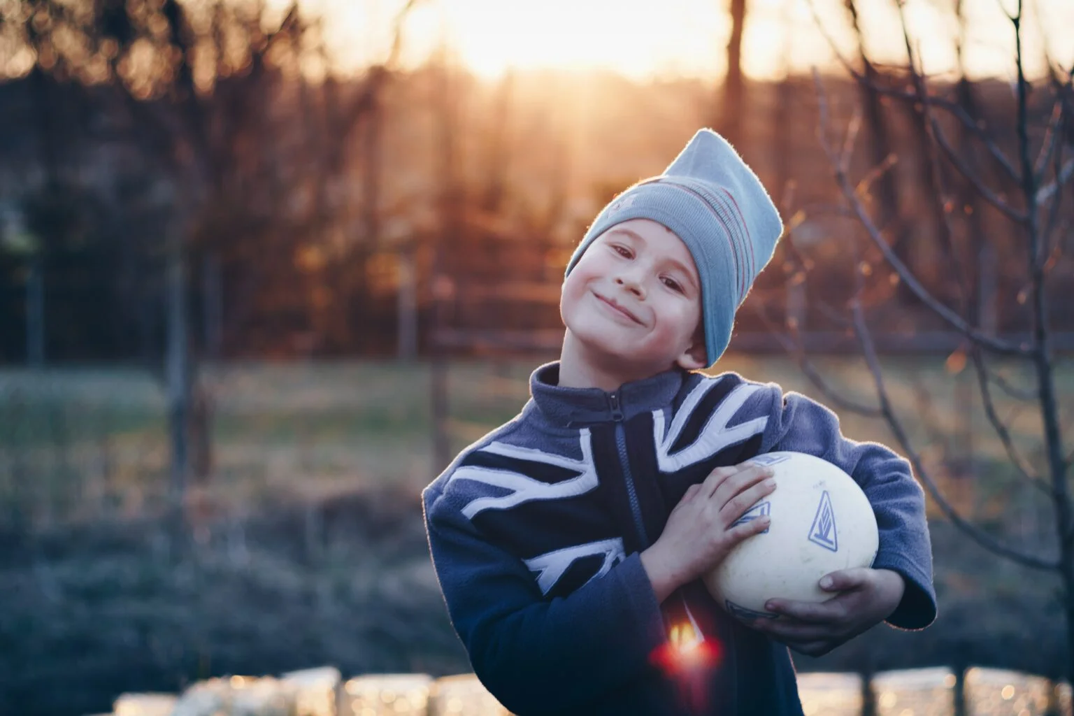 boy holding football